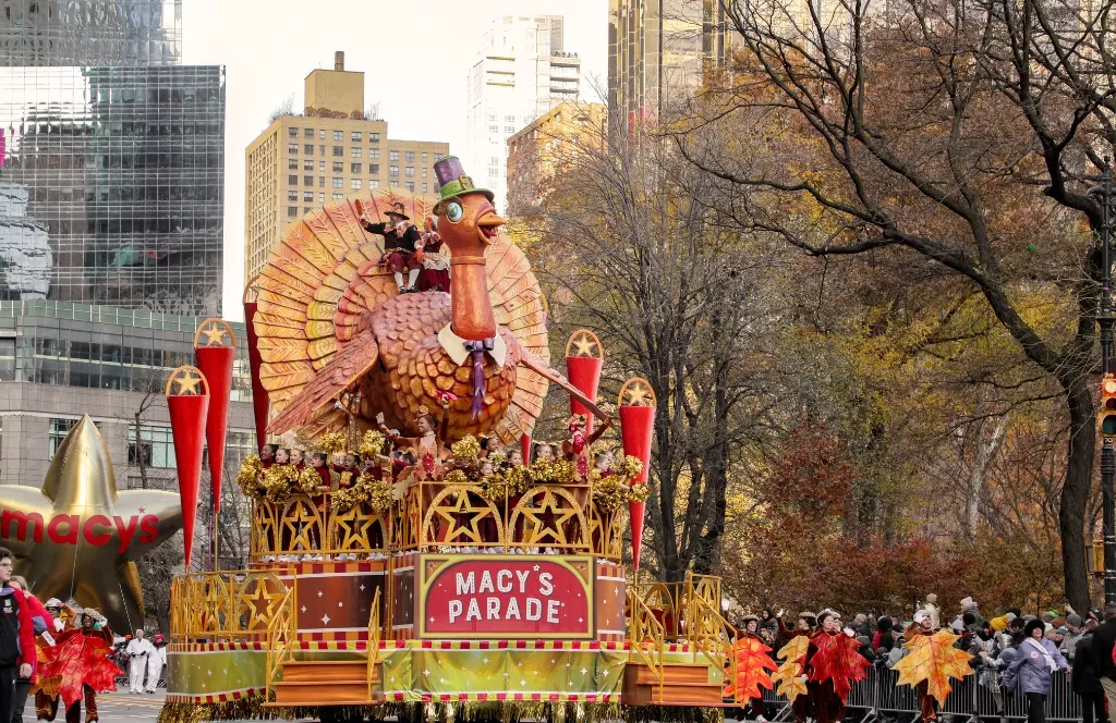 a large turkey float in a thanksgiving parade